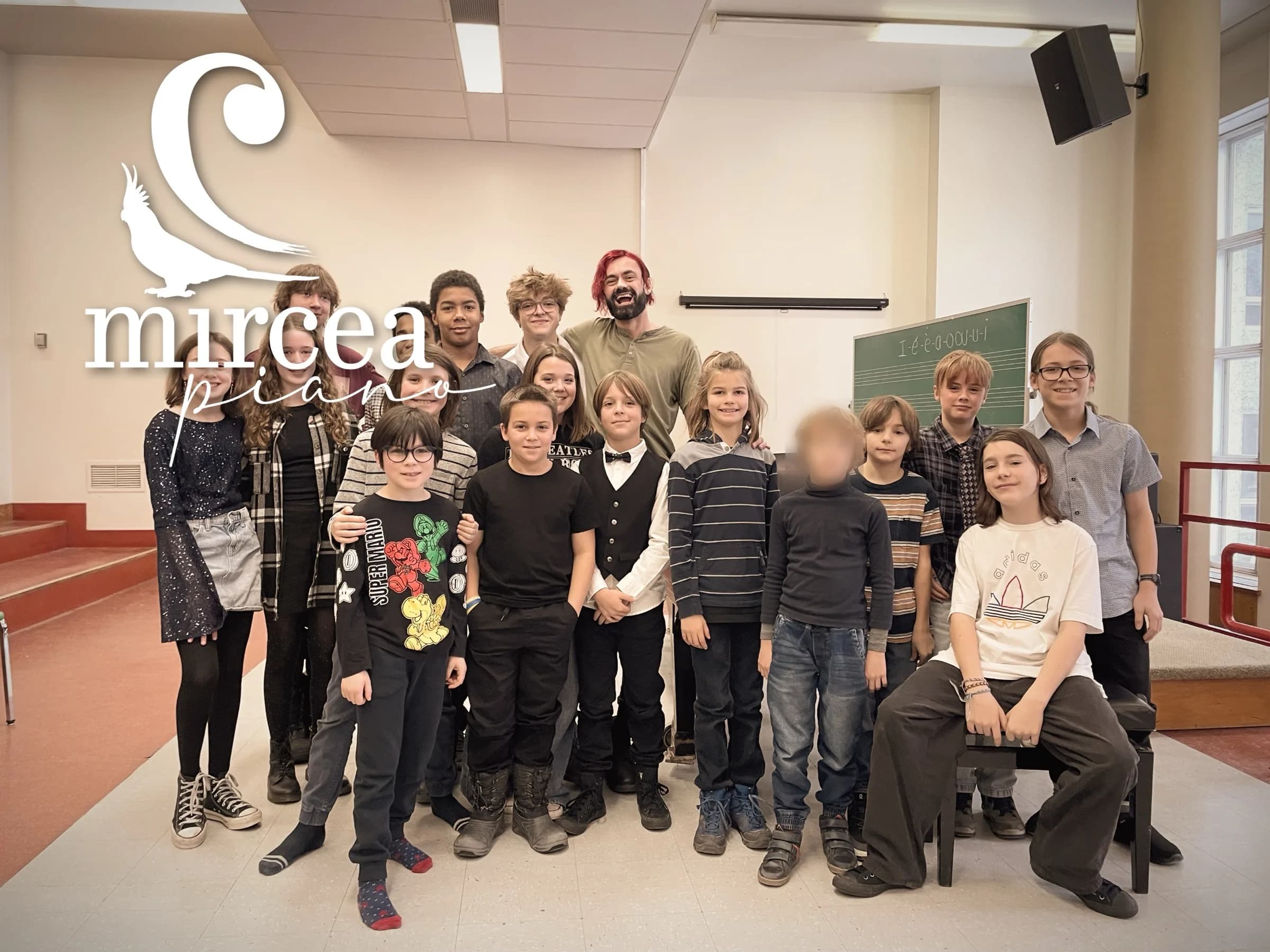 A group of students poses with Mircea after a weekly class.