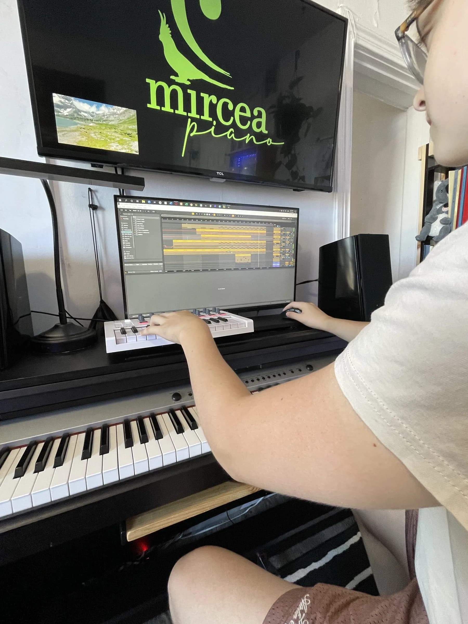 Recording and music production on the studio's keyboard, editing screen in view.